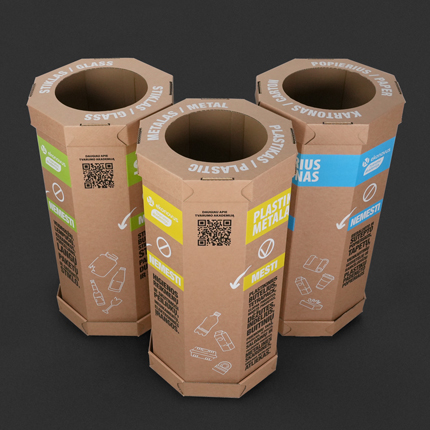 Top view of EKONOVUS sorting boxes with visible cut-out holes for different waste categories.