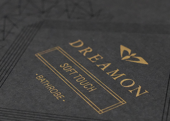 Classic gold silkscreen print adds luxury to dark packaging.